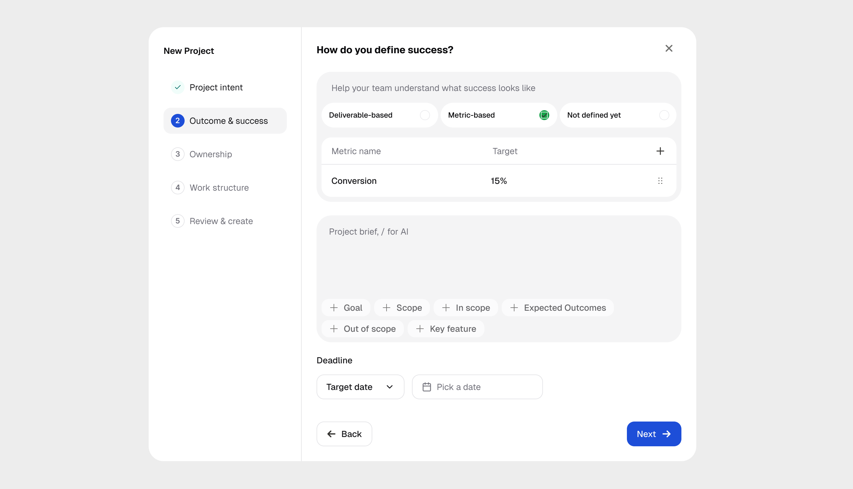 Guided project setup defining success through deliverables or metrics, with a sample conversion target and deadline